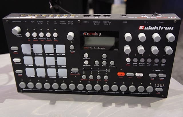 An Elektron Analog Rhythm, a black and white electronic instrument, on display.