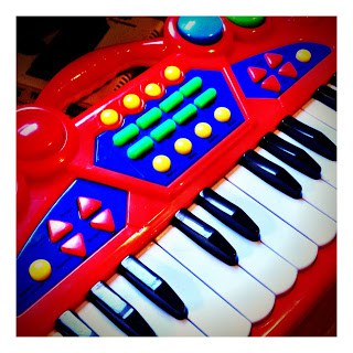 A toy keyboard with colorful keys.