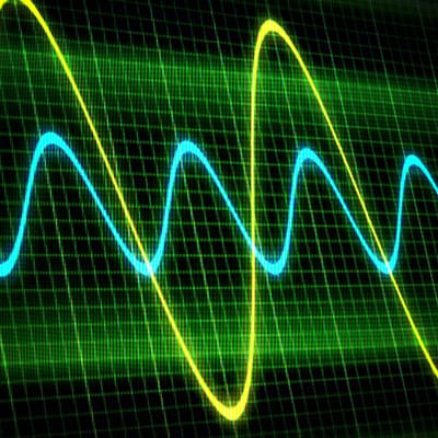 A green and blue wave is shown on a screen, displaying phase cancellation.