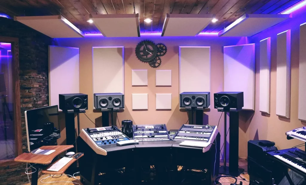 a music studio with speakers and sound mixers