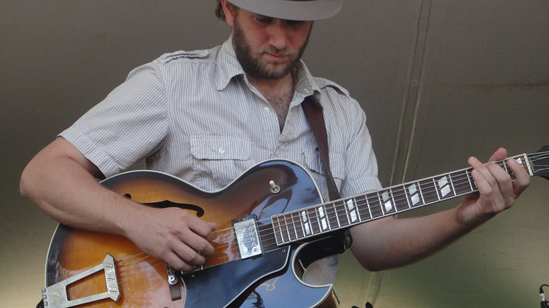 a man playing a guitar