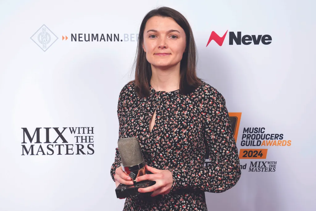 Amy Sergeant holding her award